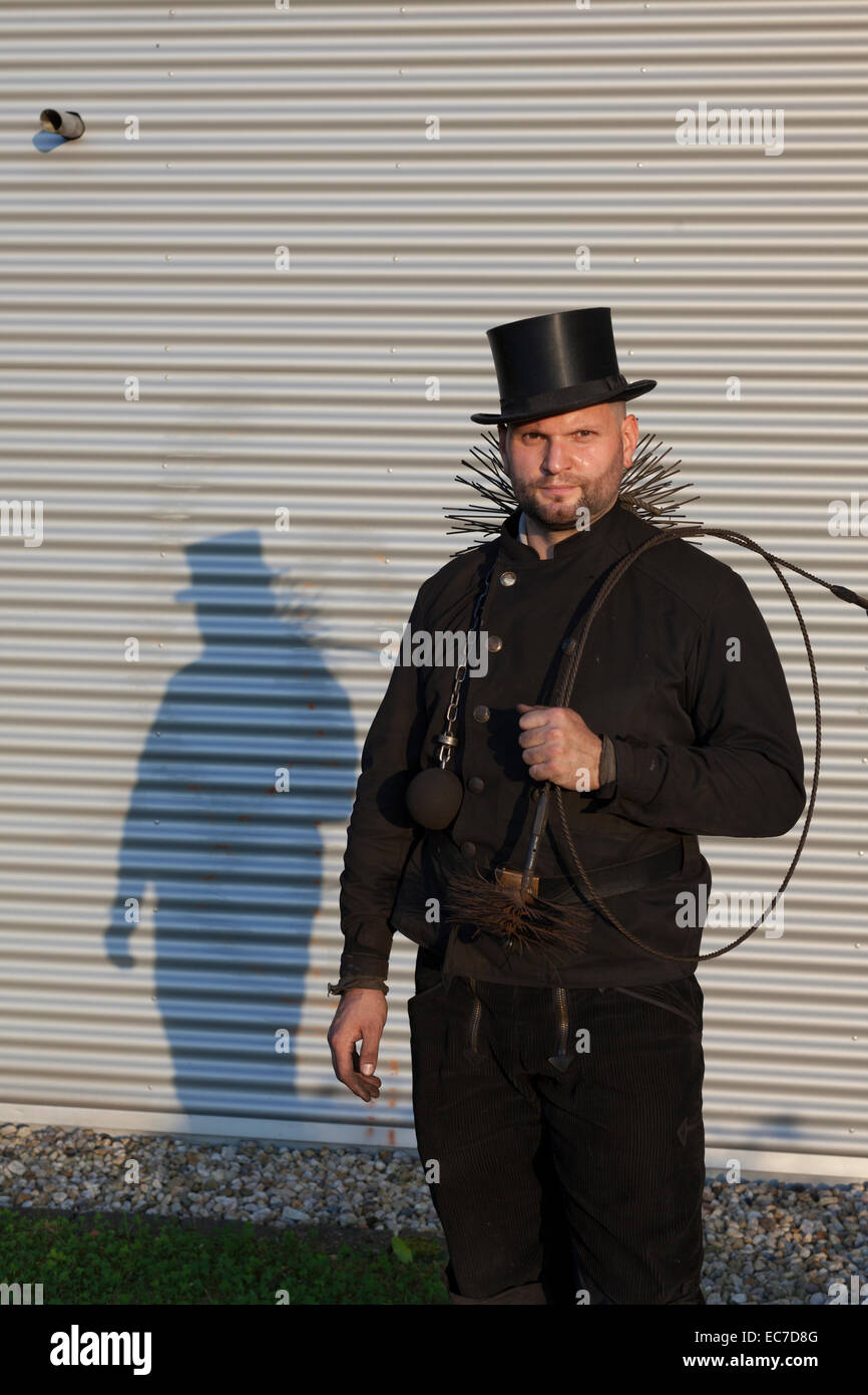 Germany, portrait of chimney sweep with working tools Stock Photo