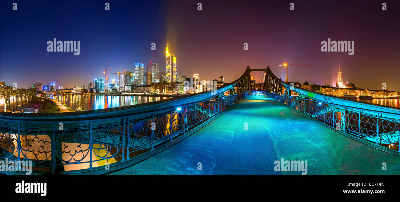 Germany, Hesse, Frankfurt, view to Eiserner Steg with skyline in the background at night Stock Photo