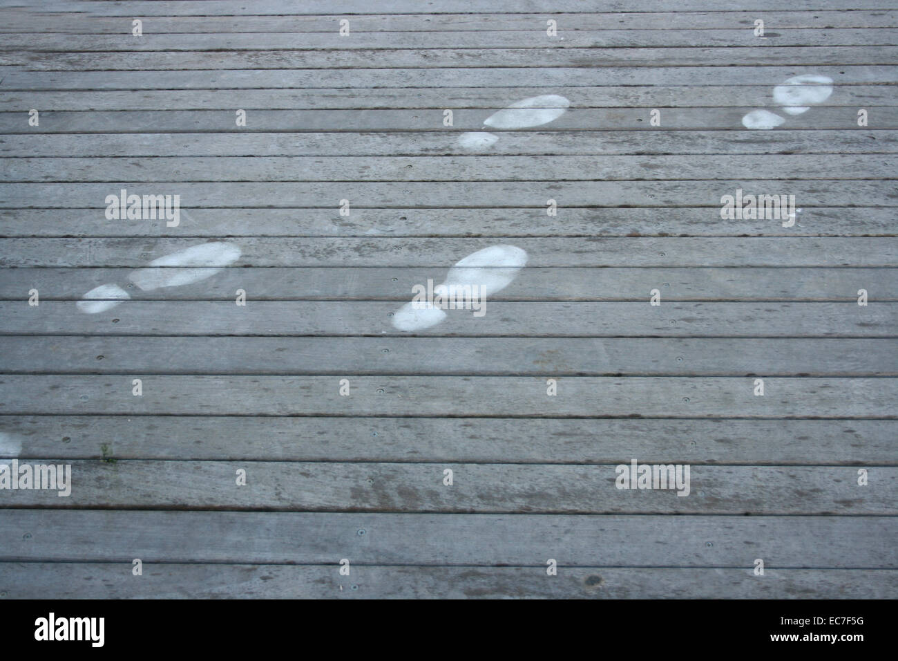 Human footprint on wooden jetty Stock Photo