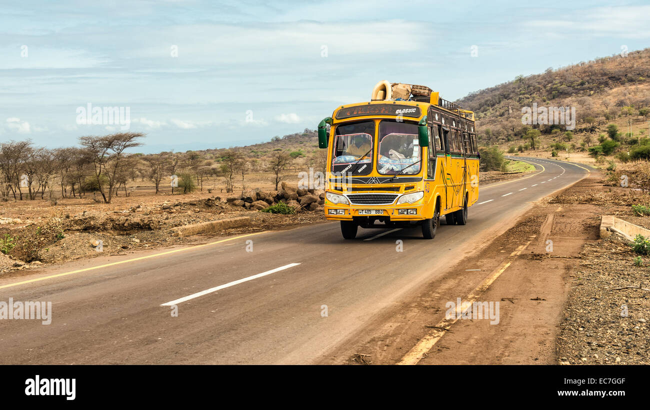Typical and overcrowded african bus driving from Arusha to Namanga, Tanzania. Stock Photo