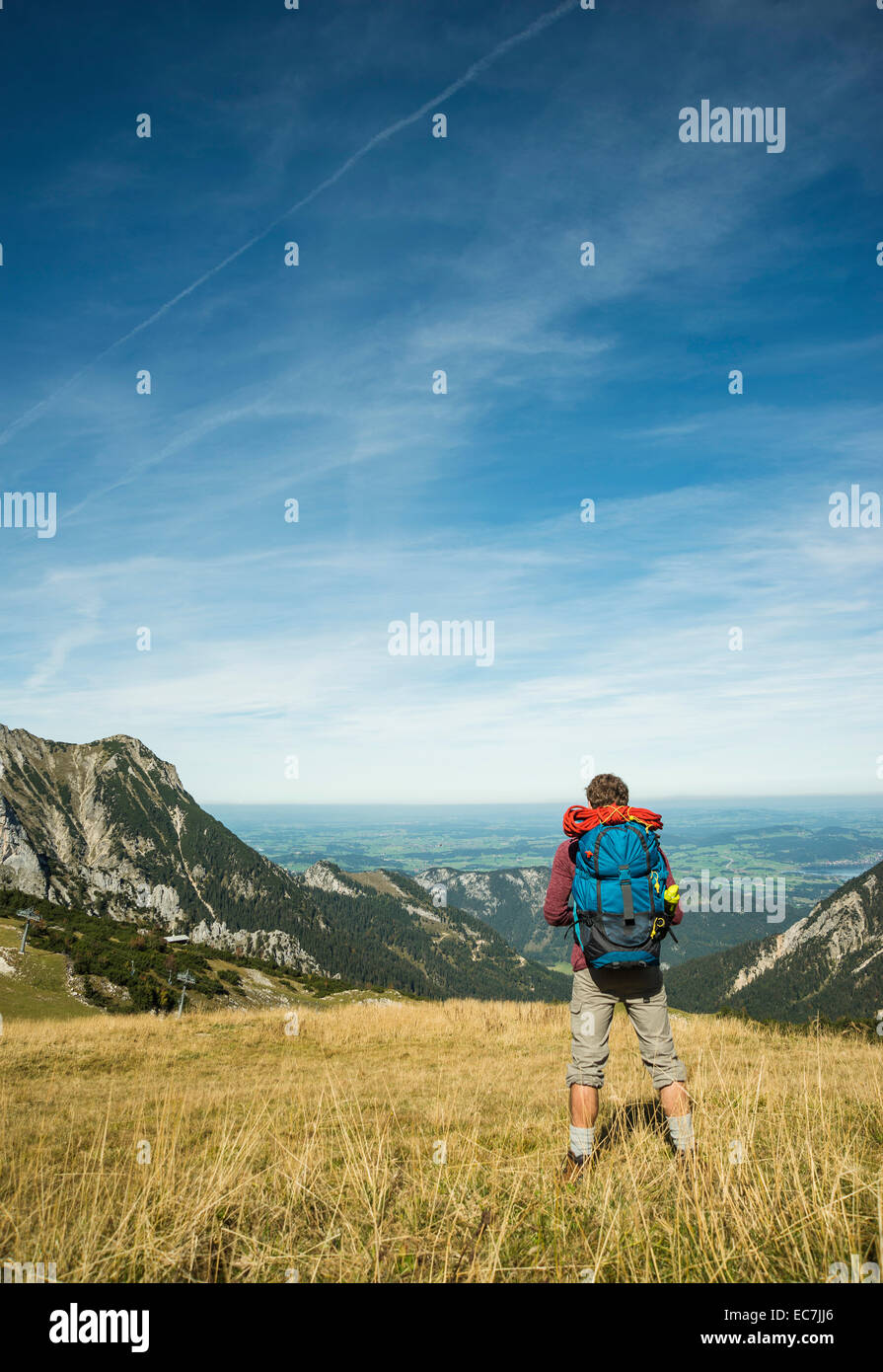 Austria, Tyrol, Tannheimer Tal, young hiker looking at view Stock Photo