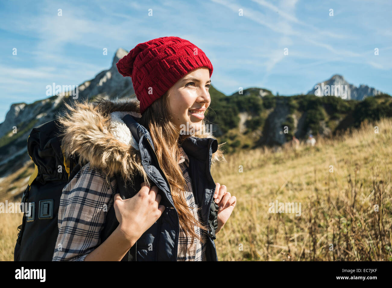 Austria, Tyrol, Tannheimer Tal, smiling young woman on hiking trip Stock Photo