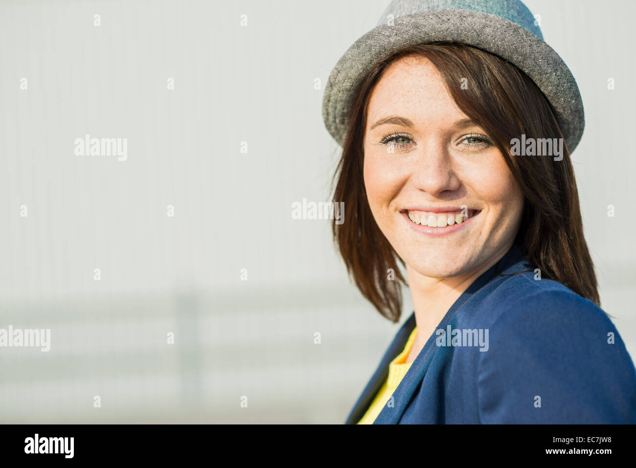 Portrait of smiling young woman wearing hat Stock Photo