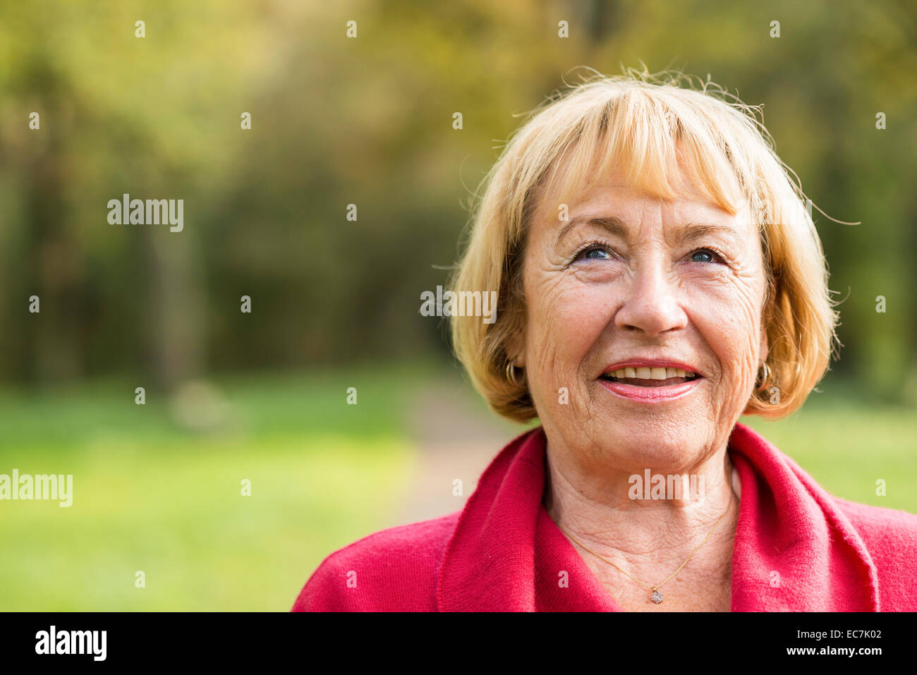 Portrait of smiling blond senior woman Stock Photo