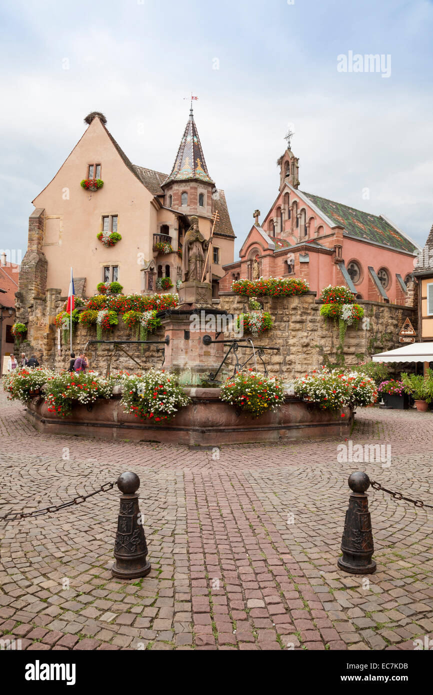 France, Alsace, Eguisheim, Place de Chateau St Leon, Chapel Saint Leon, Castle and fountain in the foreground Stock Photo