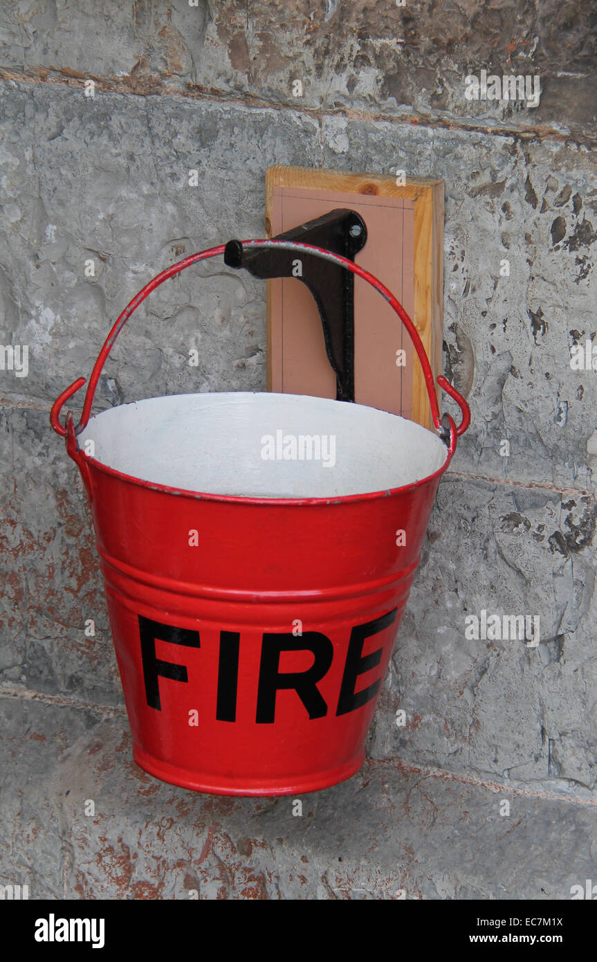 A Single Traditional Red Metal Fire Bucket. Stock Photo