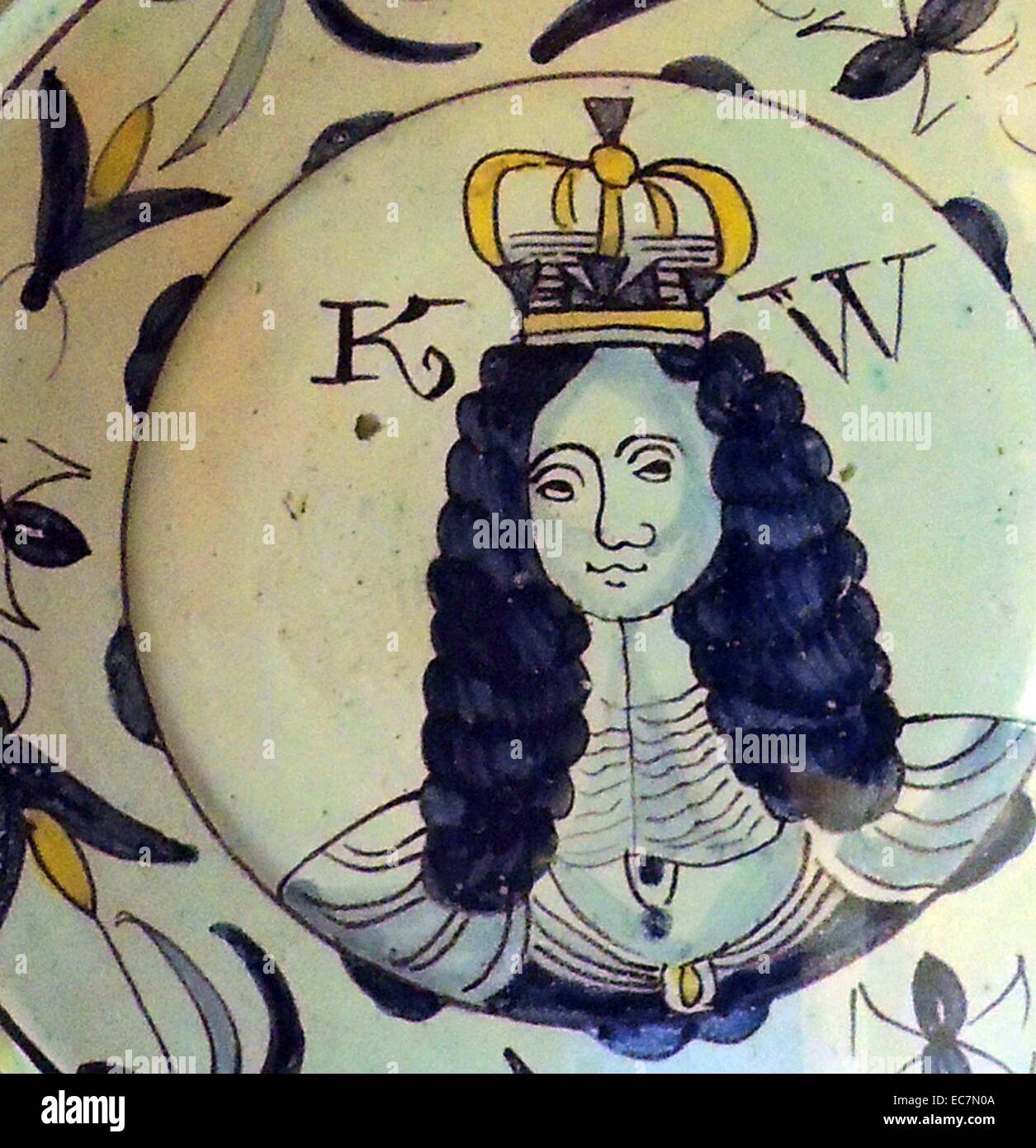 Charger, Brislington, c 1690 depicts William III who ruled jointly with his wife, Mary II.  A similar charger portraying Queen Mary features the same flying insect in the border but the flowering plants are replaced by thistles, perhaps in recognition of Mary Stuart's ancestry. Stock Photo