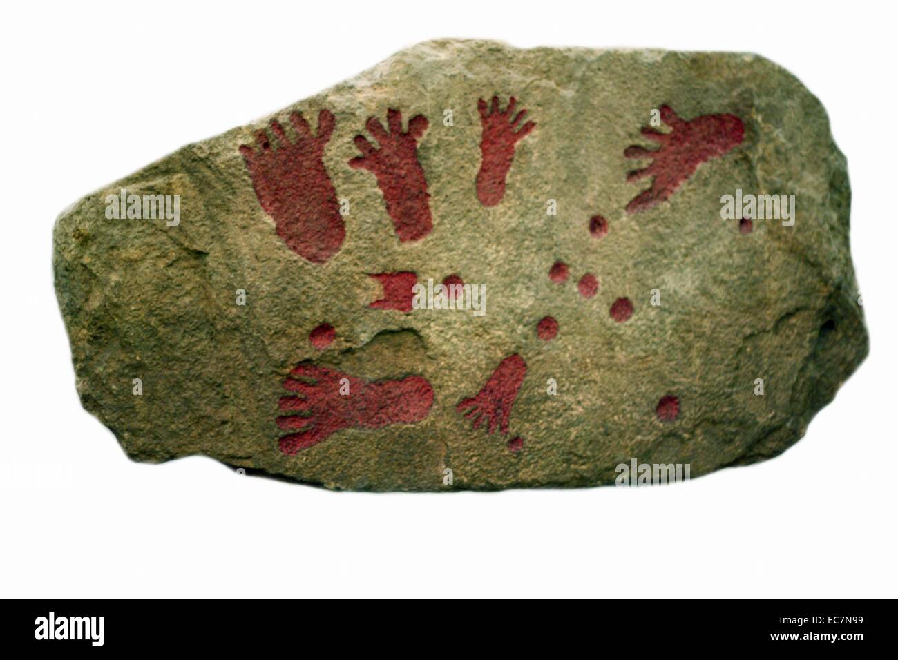 This slab of stone is part of a burial mound known as a barrow.  Remains of the dead would be placed in a stone chamber called a cist, which was then covered over by earth. Stock Photo