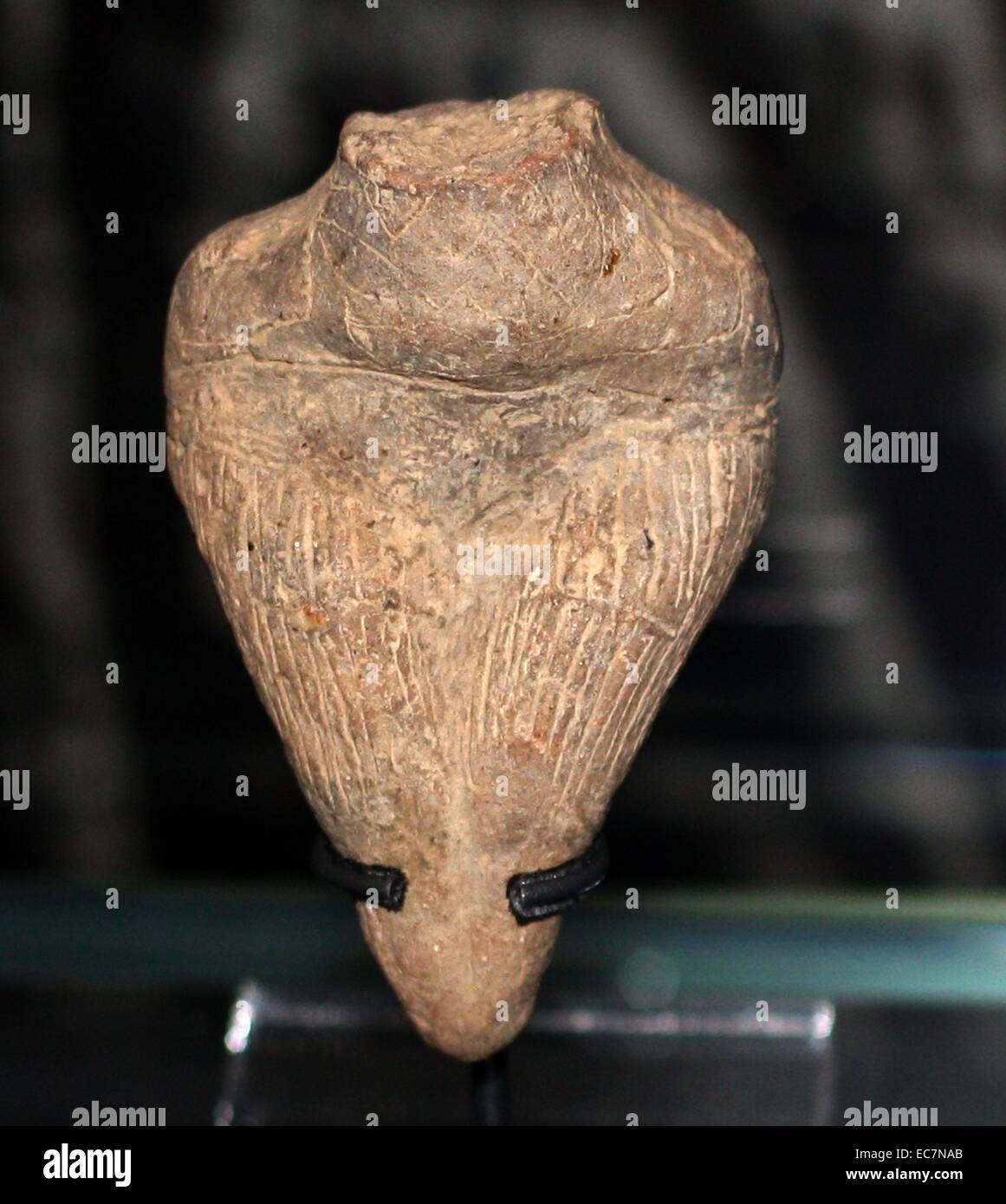 From the Vinca tell, Serbia, about 4500-4000 BC. (back) Large female figurine without head. (Left) female figurine fragment with incised decoration of clothing. Stock Photo