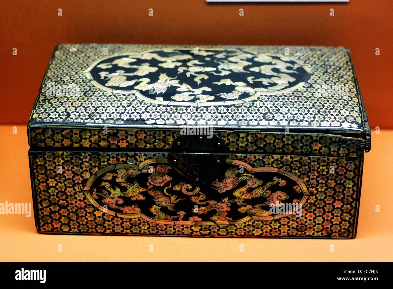 Lacquer box from Korea 1500-1600 Yi dynasty (1392-1910).  These dragons are weaving in and out of the clouds. In Korea dragons were a symbol of the Emperor, as in China. Stock Photo