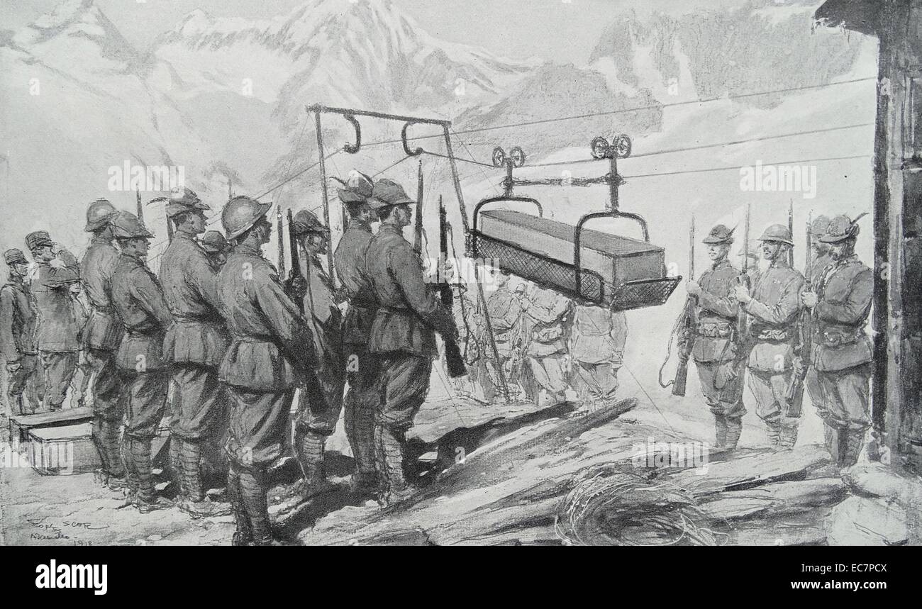 Italian soldiers prepare to transfer a coffin of a fallen soldier to be buried below the mountain position where he died. World war one Stock Photo