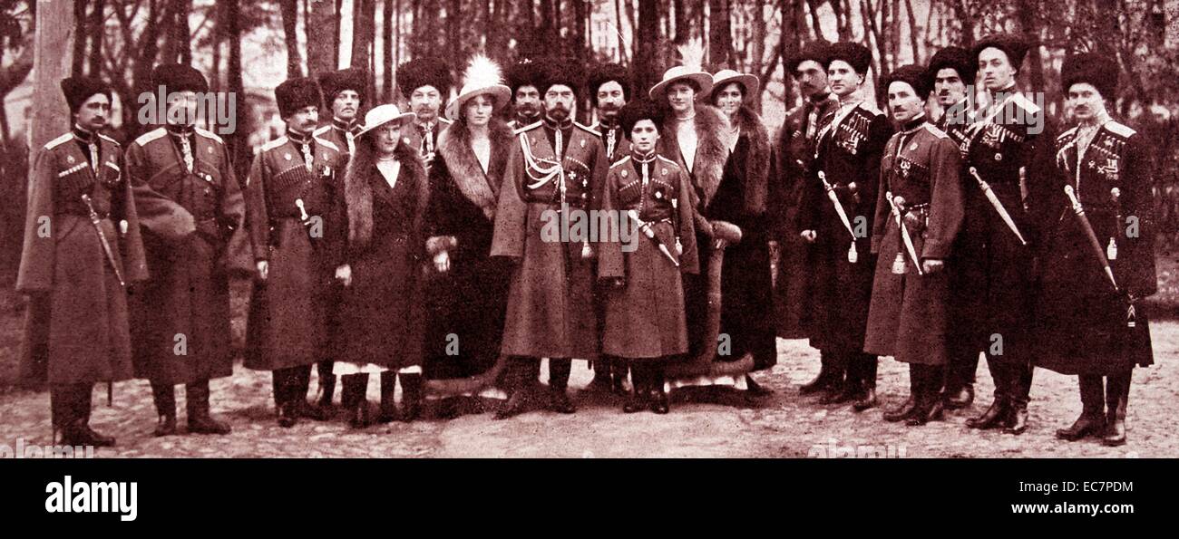 Tsar Nicholas II of Russia with Tsarevich Alexis and his sisters photographed with Cossack guards during 1916 Stock Photo