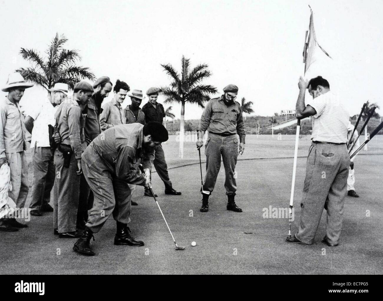 Photograph of Che Guevara (1928-1967) and Fidel Castro (1926-) playing golf to mock President Dwight D. Eisenhower (1890-1969). Dated 1962 Stock Photo