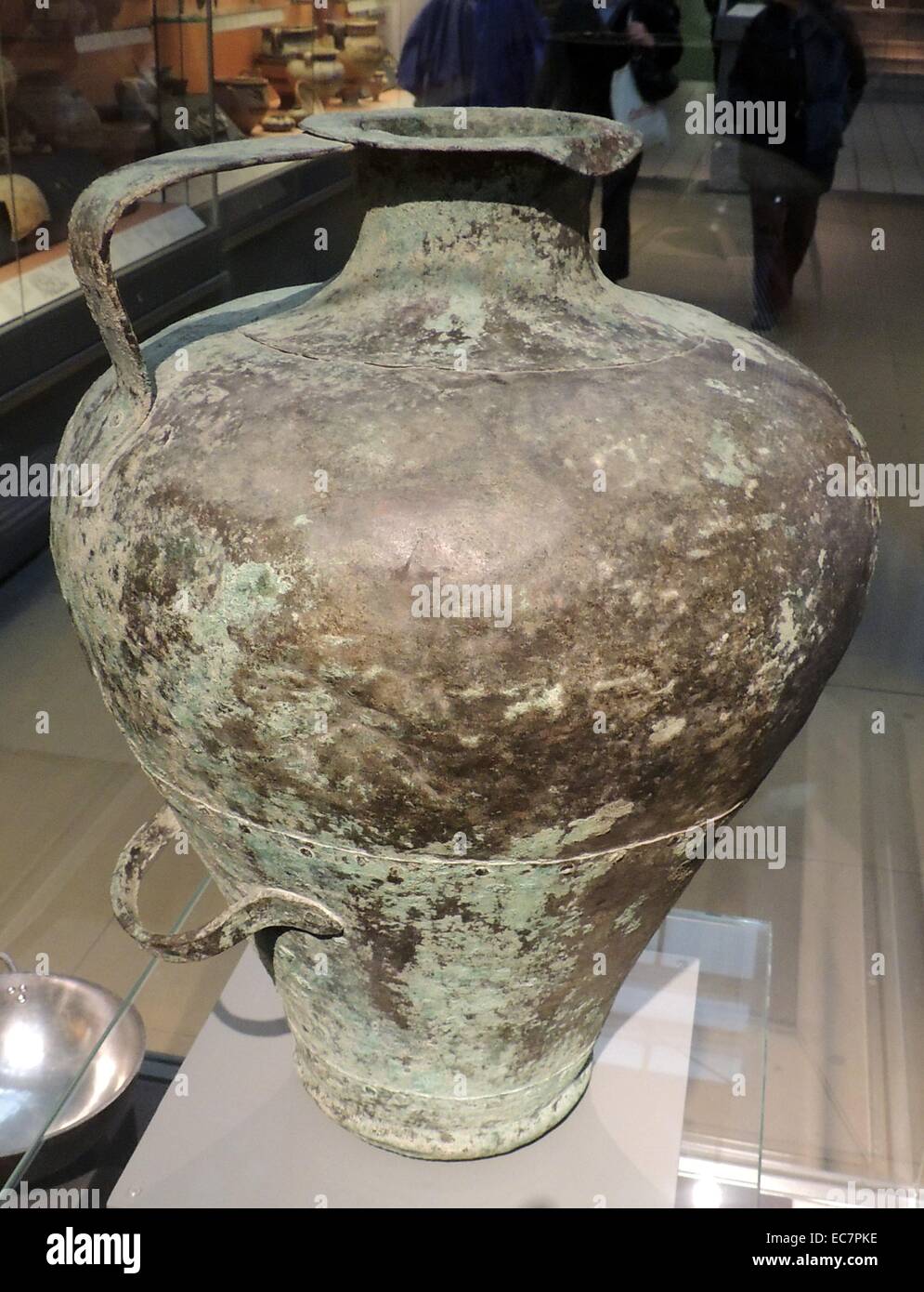 Copper pitcher.  Mycenaean, 1500-1300 BC - probably from the Peloponnese.  The pitcher was made from four sheets of copper, hammered to shape and riveted together.  It is a remarkably well-preserved example of a type of vessel which was fairly common, but rarely survived intact. Stock Photo