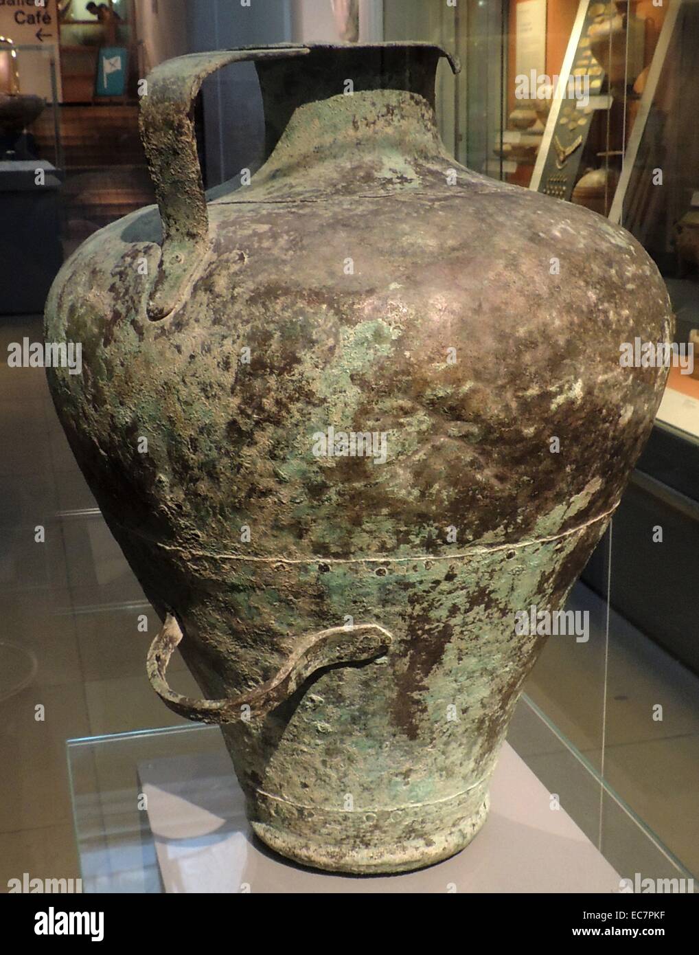 Copper pitcher.  Mycenaean, 1500-1300 BC - probably from the Peloponnese.  The pitcher was made from four sheets of copper, hammered to shape and riveted together.  It is a remarkably well-preserved example of a type of vessel which was fairly common, but rarely survived intact. Stock Photo