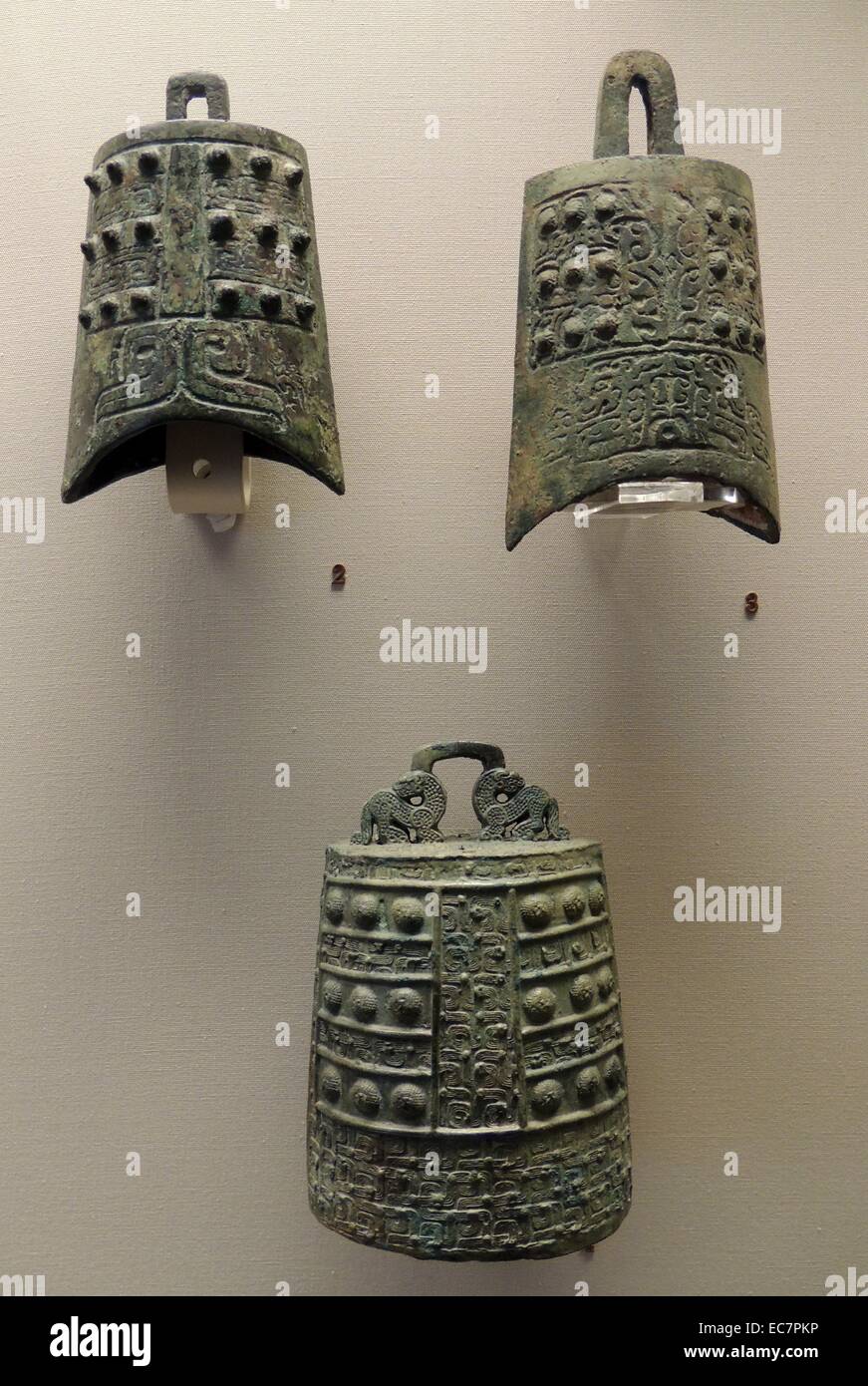 Bronze bell.  Possibly from Southeast China, Early Eastern Zhou, 8th-7th century. The S-shaped dragons retain the form of earlier Western Zhou ornament.  At this date the bronze casting tradition of Southern China was very conservative. Stock Photo