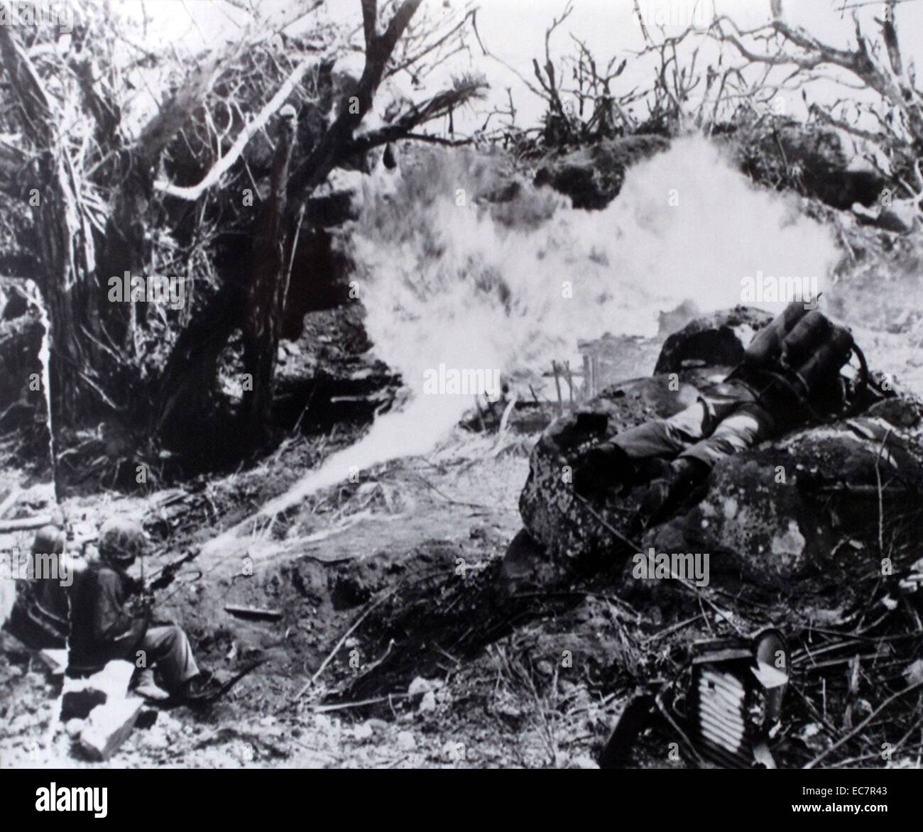 Photograph of U.S Marines using flamethrowers on a Japanese position, Tarawa,  Kiribati. Dated 1944 Stock Photo
