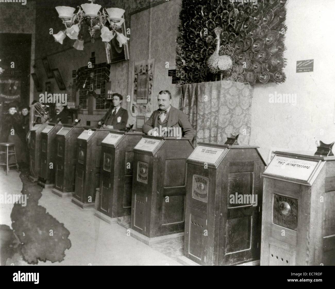 Albert Einstein's 'Peep Show' Kinetoscope Arcade. The kinetoscope was an early motion picture exhibition device that allowed films to be viewed by one person at a time through a peephole viewer window on top. This was the basic model for later movie projections. Stock Photo