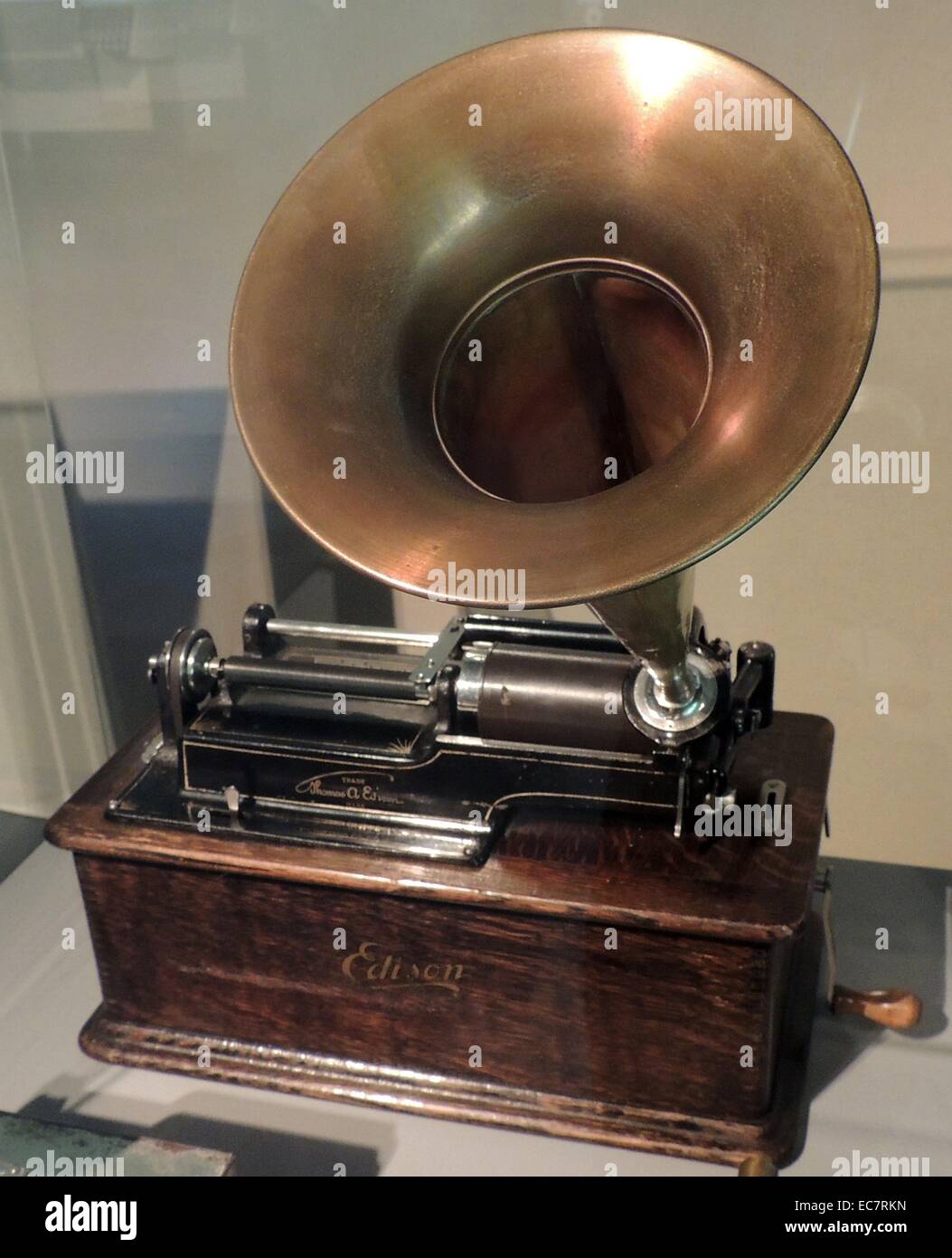Edison's Phonograph. In 1877 Thomas Edison filed a patent on a machine that could record and play back sound.  He demonstrated this simple device by reciting the poem Mary had a little lamb.  His voice caused the membrane in the microphone to vibrate.  A stylus attached to the membrane drew grooves of varying depth in a sheet of tinfoil wrapped around a rotating cylinder which moved along the microphone with the stylus. Stock Photo