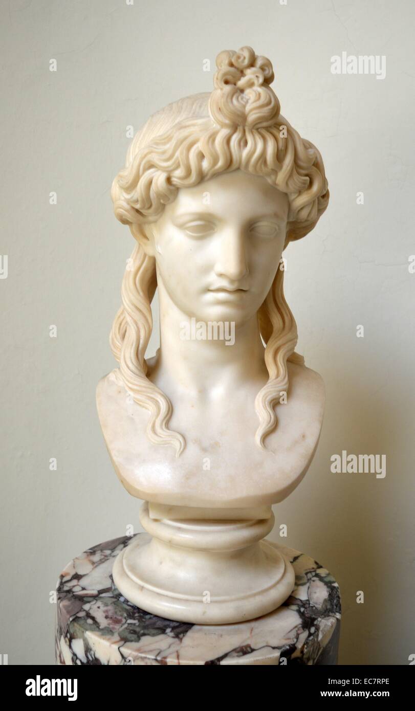 Bust of Isis by Joseph Cott (1786-1860).  The head is a copy of one in the Sala dei Busti of the Museo Pio-Clementino in the Vatican.  The Vatican bust has been acquired from Cardinal Albani's collection and published as representing the Egyptian goddess Isis, on account of the lotus-shaped central curls, it is now regarded simply as an ideal female.  The English sculptor Joseph Gott worked in Rome from 1822. Stock Photo