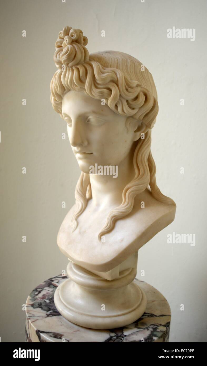 Bust of Isis by Joseph Cott (1786-1860).  The head is a copy of one in the Sala dei Busti of the Museo Pio-Clementino in the Vatican.  The Vatican bust has been acquired from Cardinal Albani's collection and published as representing the Egyptian goddess Isis, on account of the lotus-shaped central curls, it is now regarded simply as an ideal female.  The English sculptor Joseph Gott worked in Rome from 1822. Stock Photo