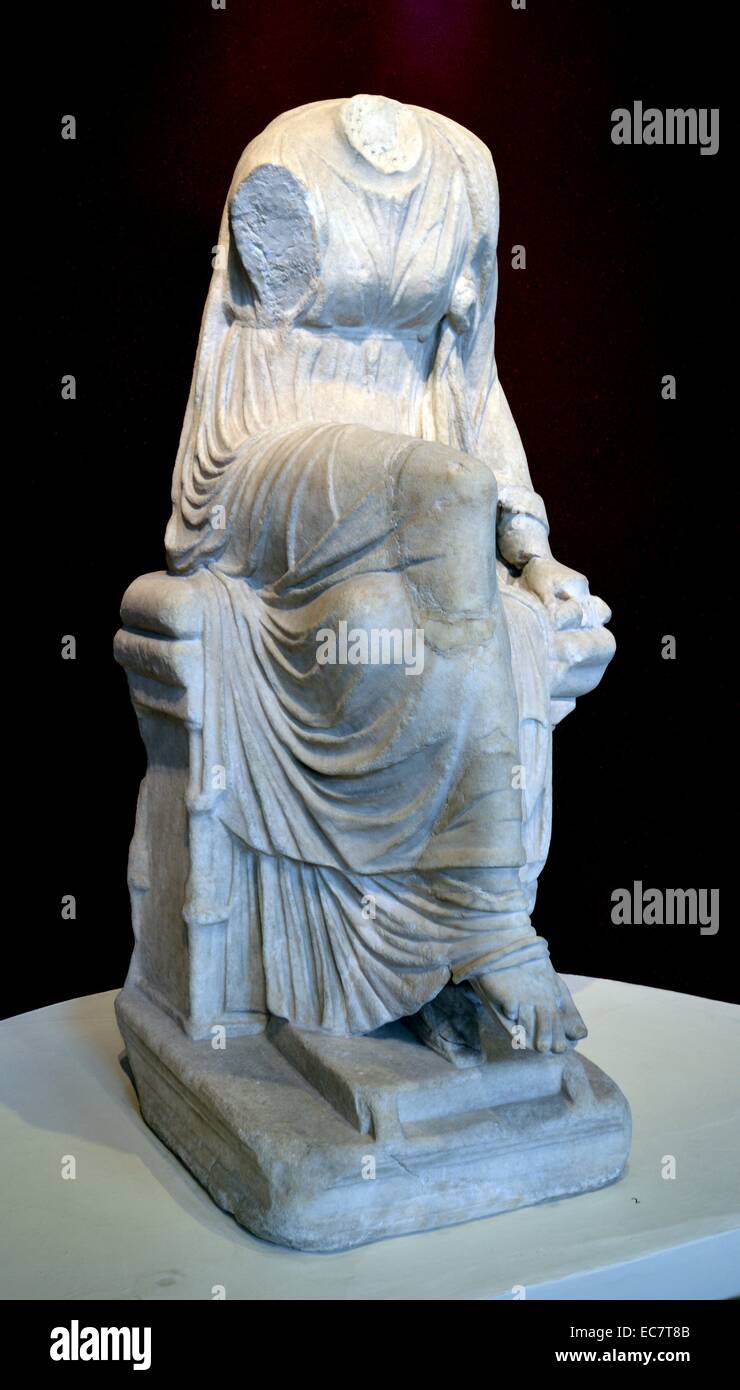 Marble statue of a seated muse. This is Clio, the muse of history who holds a scroll in her left hand.  Roman, AD 1-200. Stock Photo
