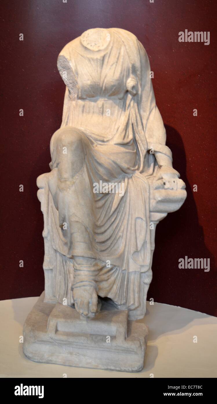 Marble statue of a seated muse. This is Clio, the muse of history who holds a scroll in her left hand.  Roman, AD 1-200. Stock Photo