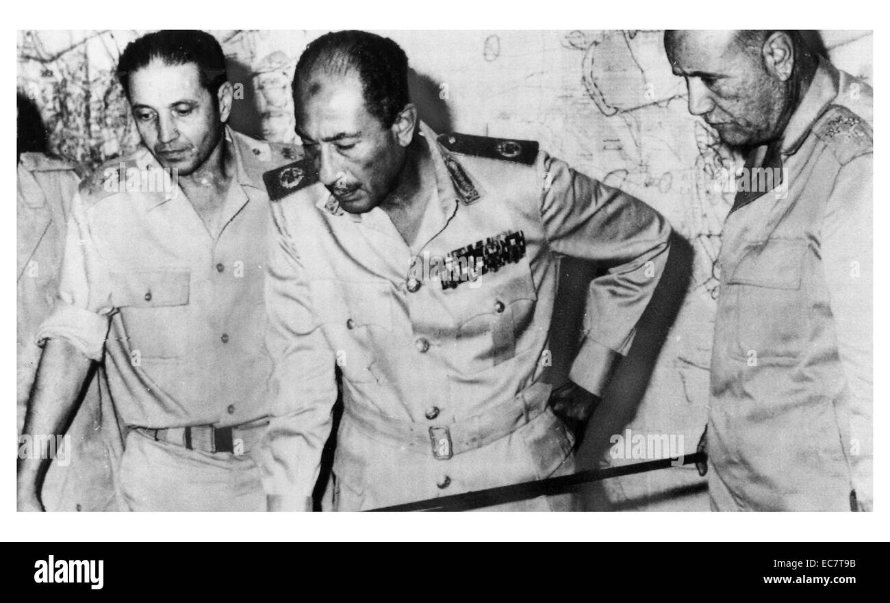 Egypt's chief of staff Saad el-Shazly (left), President Anwar Sadat  (centre) and minister of war' Ismail Ali (right) review battlefield developments in the 1973 Arab-Israeli War Stock Photo
