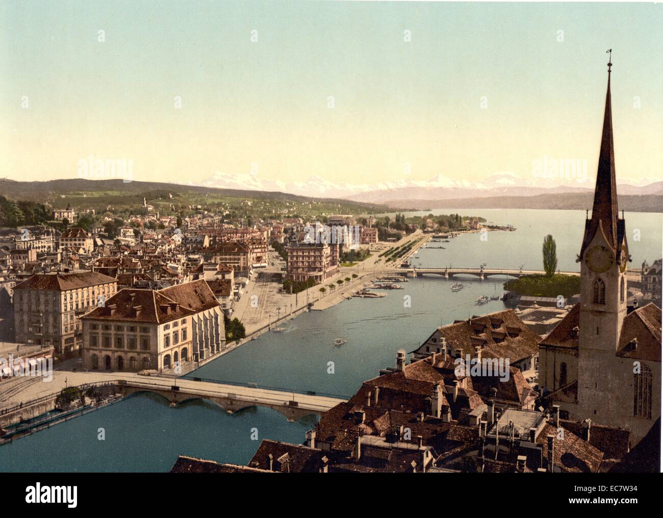 Colour river scene in Zurich, Switzerland. Shot between 1890 and 1900. The scene shows two bridges at the mouth of the river. Stock Photo