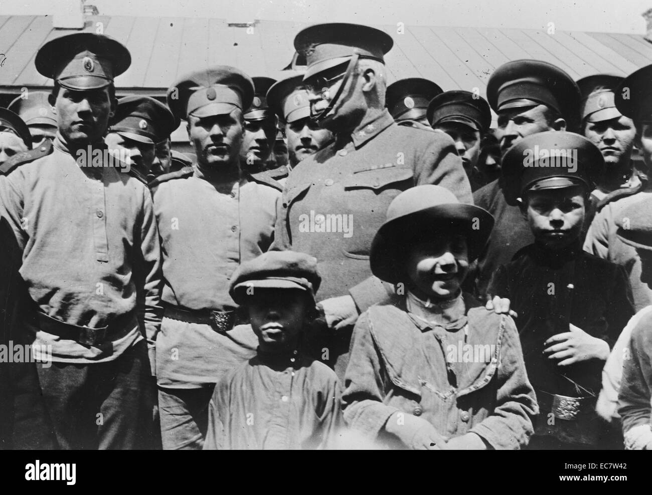Russian war pictures. Solders and children standing with General H.L. Scott. Dated around 1917. Stock Photo