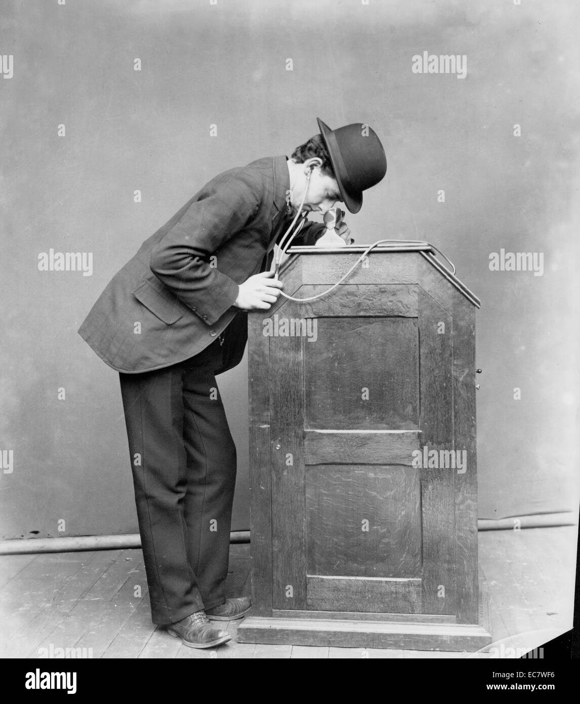 Albert Einstein's Kinetoscope Arcade. The kinetoscope was an early motion picture exhibition device that allowed films to be viewed by one person at a time through a peephole viewer window on top. This was the basic model for later movie projections. Stock Photo