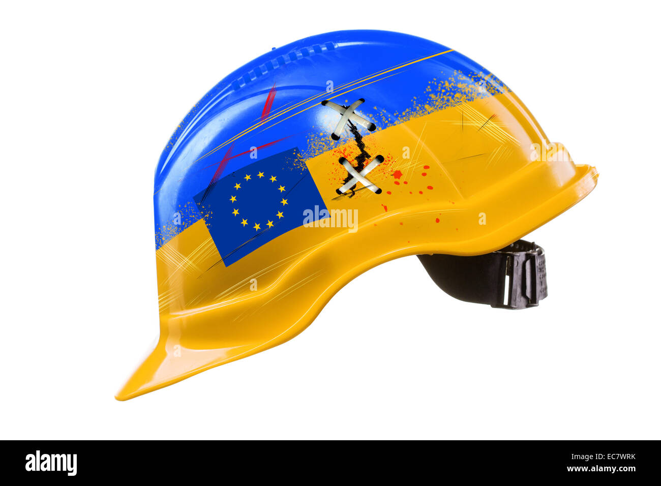 Blue and yellow hard hat with cracks, scratches and EU flag. KIEV, UKRAINE - DECEMBER 1: Ukraine police smash pro-Europe protest Stock Photo