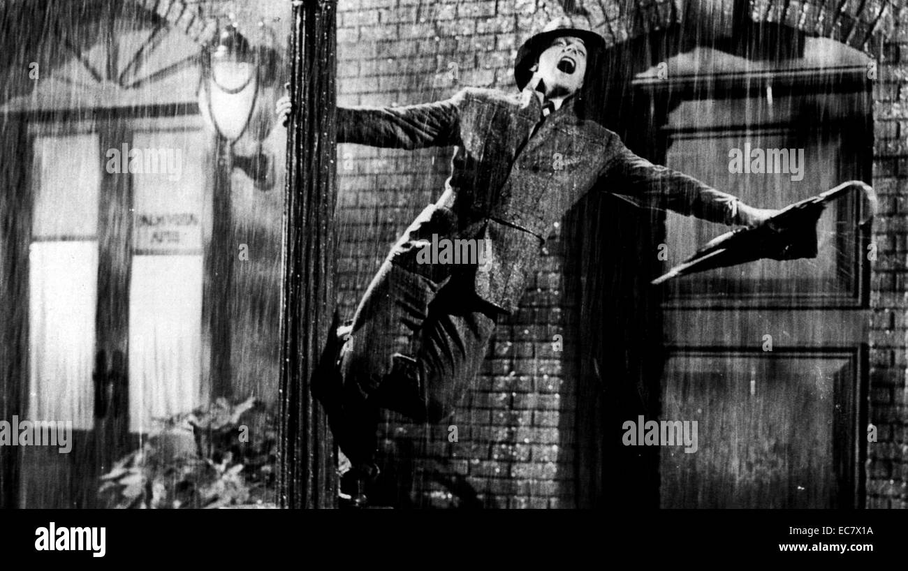 Singin' in the Rain is a 1952 American musical comedy film directed by Gene Kelly and Stanley Donen and starring Kelly, Donald O'Connor and Debbie Reynolds. It offers a lighthearted depiction of Hollywood in the late '20s, with the three stars portraying performers caught up in the transition from silent films to 'talkies.' Stock Photo