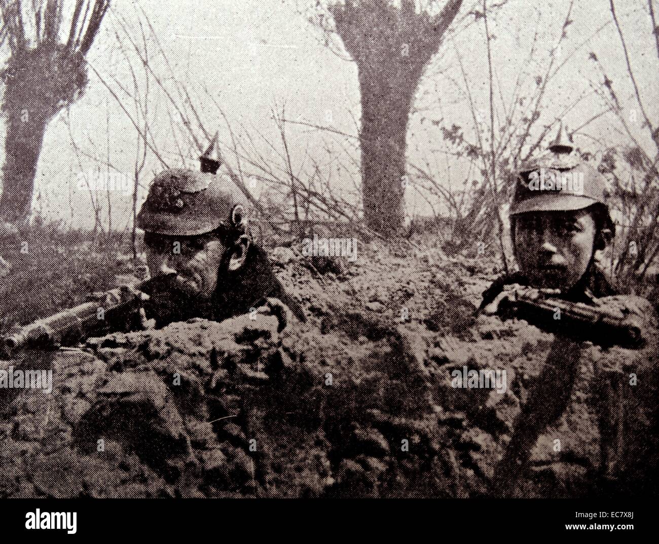 Belgian soldiers with captured German helmets in the trenches;   world war one 1914 Stock Photo