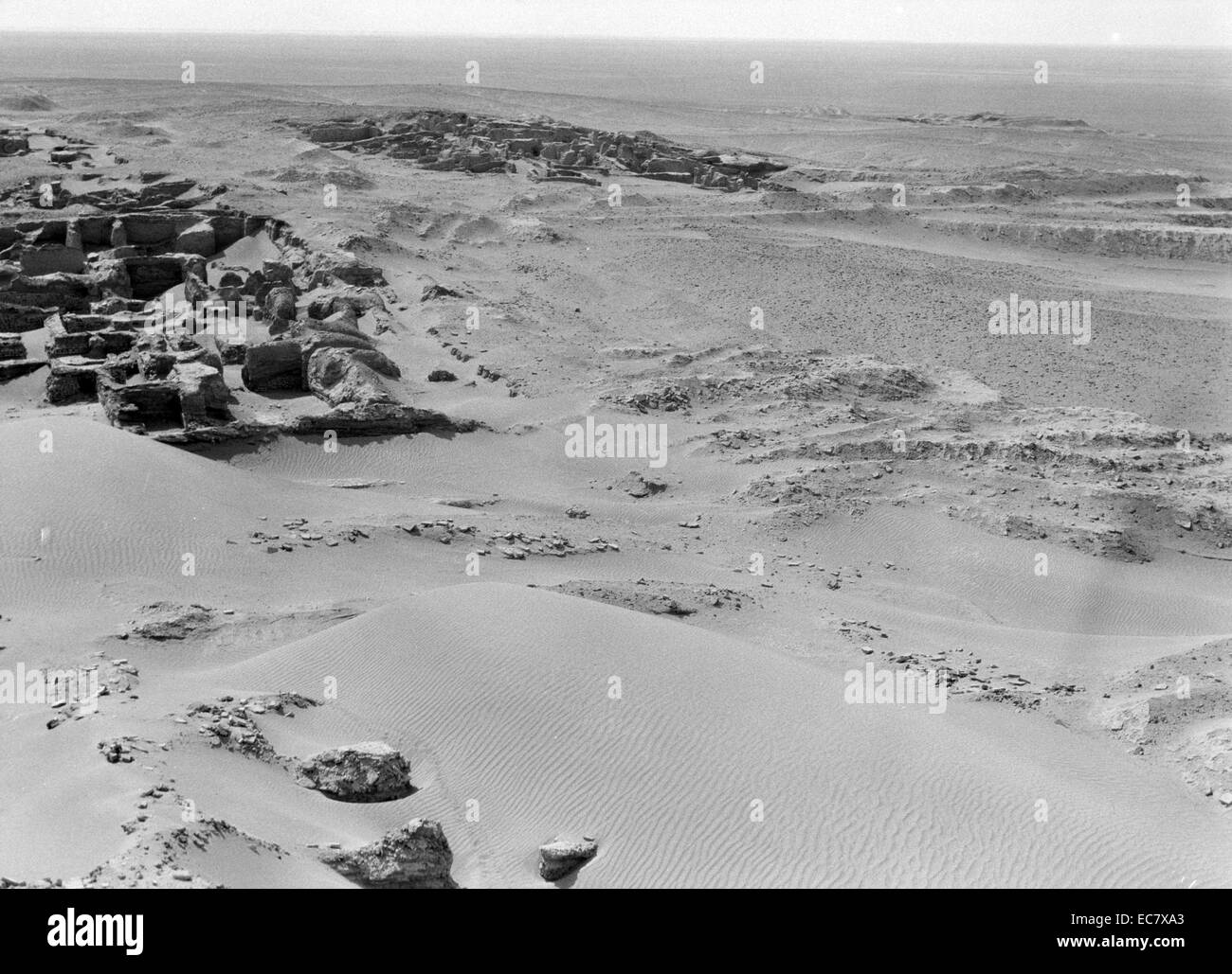 Iraq. Ur. Sand encroaching on excavated ruins. Scene from the top of the ziggurat. The earliest ziggurats began near the end of the Early Dynastic Period.[2] The latest Mesopotamian ziggurats date from the 6th century BC. Stock Photo