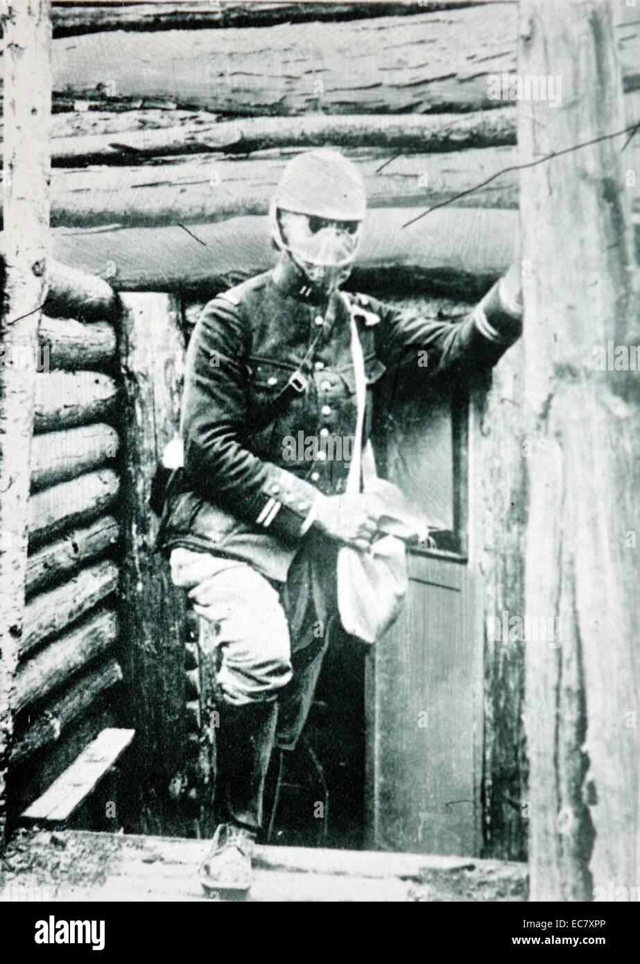 French soldier emerges in gas mask from a trench during World war One Stock Photo