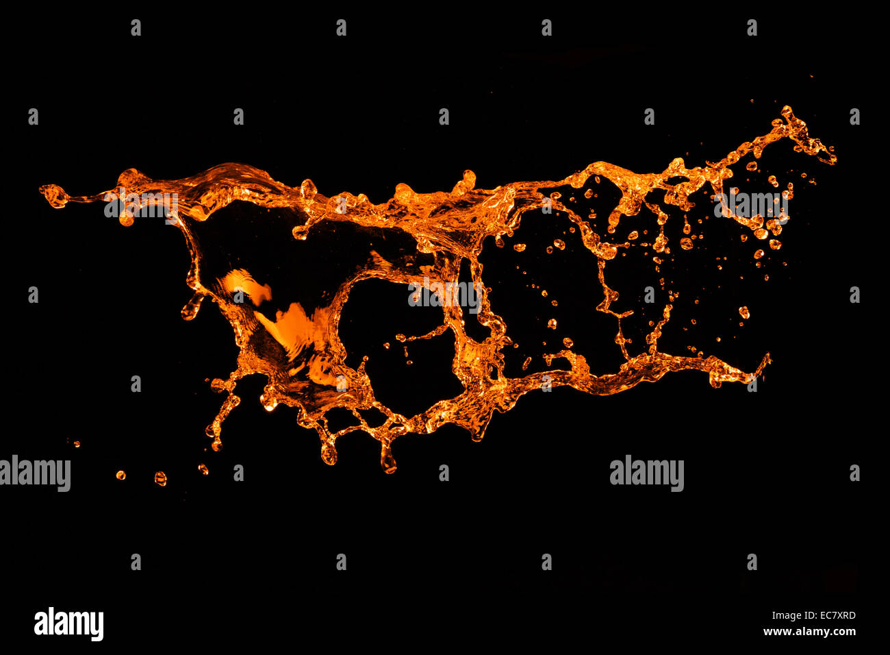 orange water splash isolated on black Stock Photo - Alamy