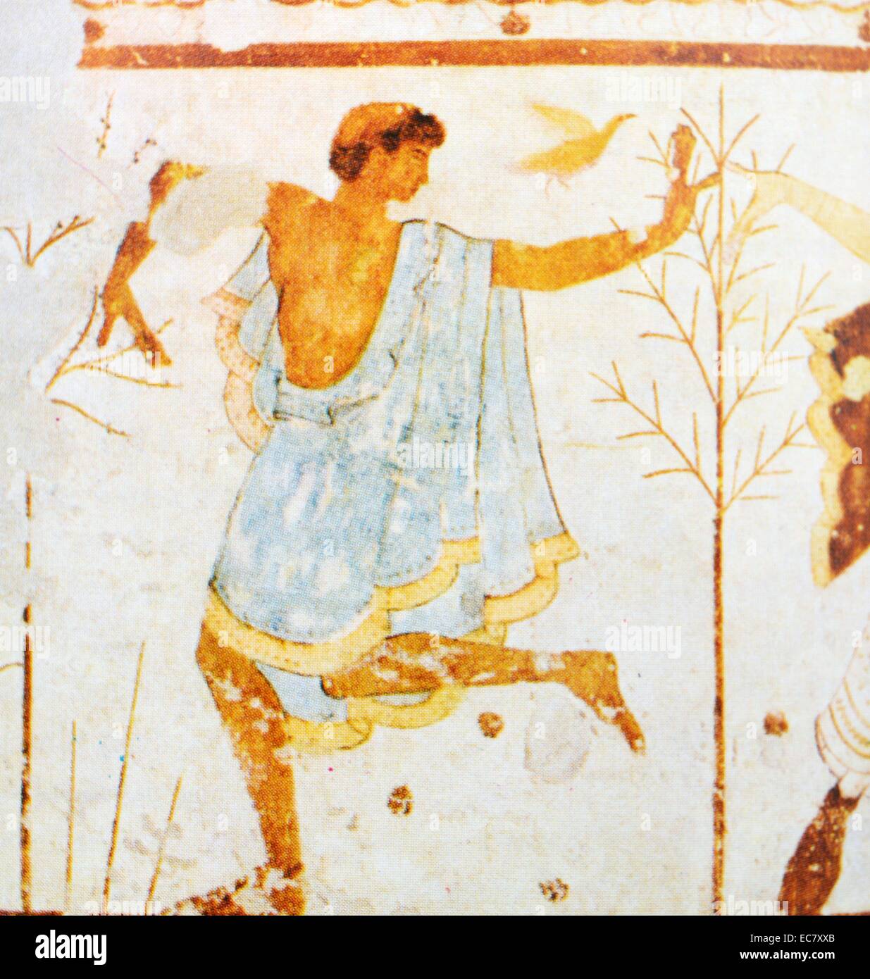 Dancing youth.  Detail of a wall painting from the Tomb of the Triclinium, Tarquinia.  Atticizing phase of Greco Etruscan painting (c. 475-400 BC).  A number of Etruscan tomb paintings reveal an affinity in style with Attic vase paintings of the latter phase of the Archaic style, dated in the first third of the fifth century BC. Stock Photo