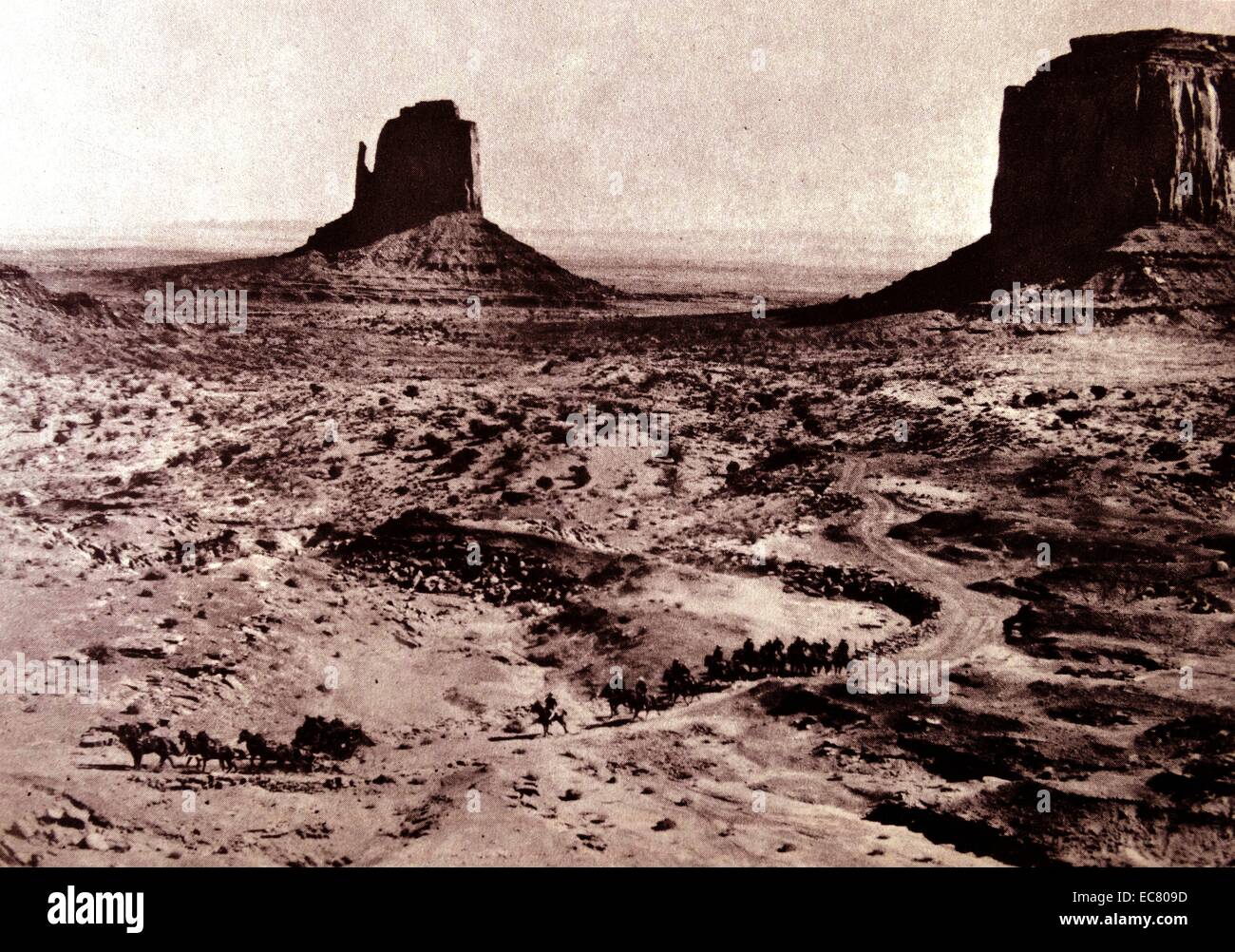 Stagecoach 1939.  The coach, followed by cavalry, winds through the desert.  John Ford gave this film the shape and unity of The Covered Wagon by focusing on the adventures of a single stage and its occupants. Stock Photo