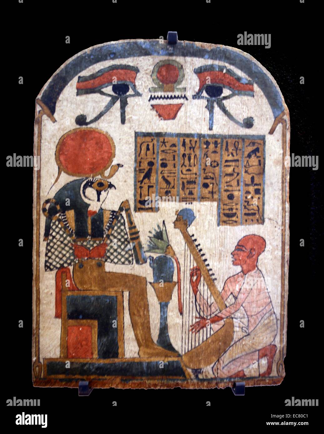 Stele of the musician Amon Djedkhonsouiouefankh playing the harp before the god Ra-Harakte. 3rd intermediate period; 1069-664 B.C. Stock Photo