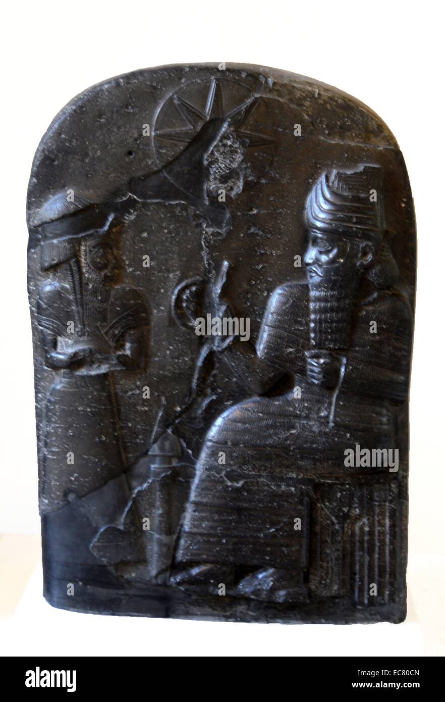 Babylonian stele reported as war booty, partly hammered. Basalt. 12th century BC Stock Photo