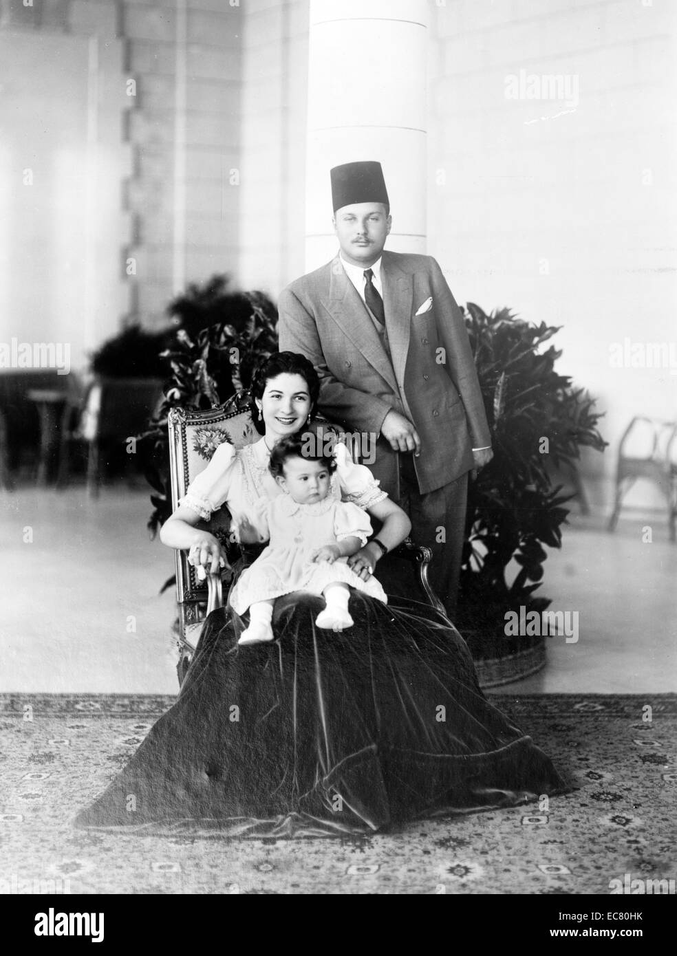 Princess Ferial with King Farouk and Queen Farida, c. 1940. Farouk I of Egypt (1920 – 1965) tenth ruler from the Muhammad Ali Dynasty and the penultimate King of Egypt and the Sudan, succeeding his father, Fuad I of Egypt, in 1937 Stock Photo