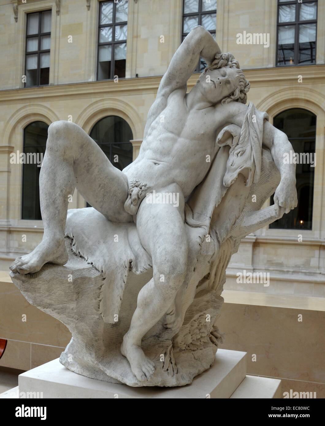Marble statue of a 'Sleeping Faun' by Edme Bouchardon (1698-1762), a French sculptor who was esteemed as the greatest sculptor of his time. Dated 17th century. Stock Photo