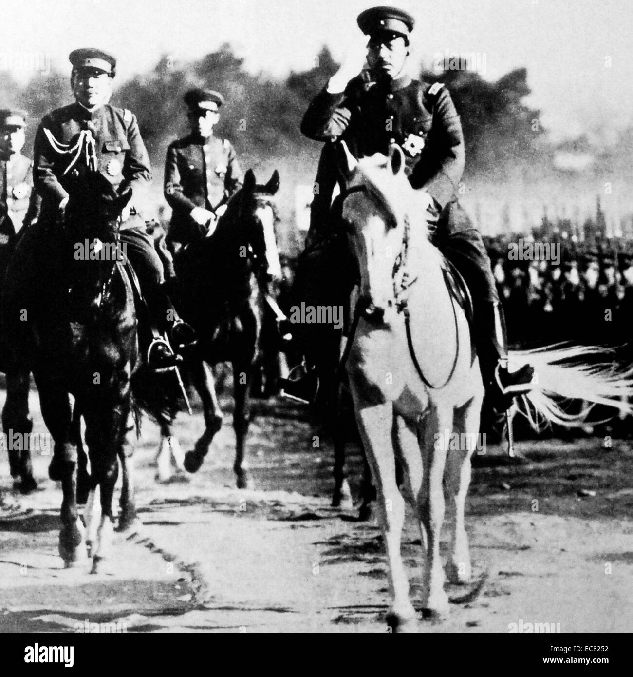 Image of Emperor Hirohito (Emperor Showa) riding his horse during an army inspection. He was the Emperor of Japan from 25th of December 1926 Until his death in 1989. Image taken around 1938. Stock Photo