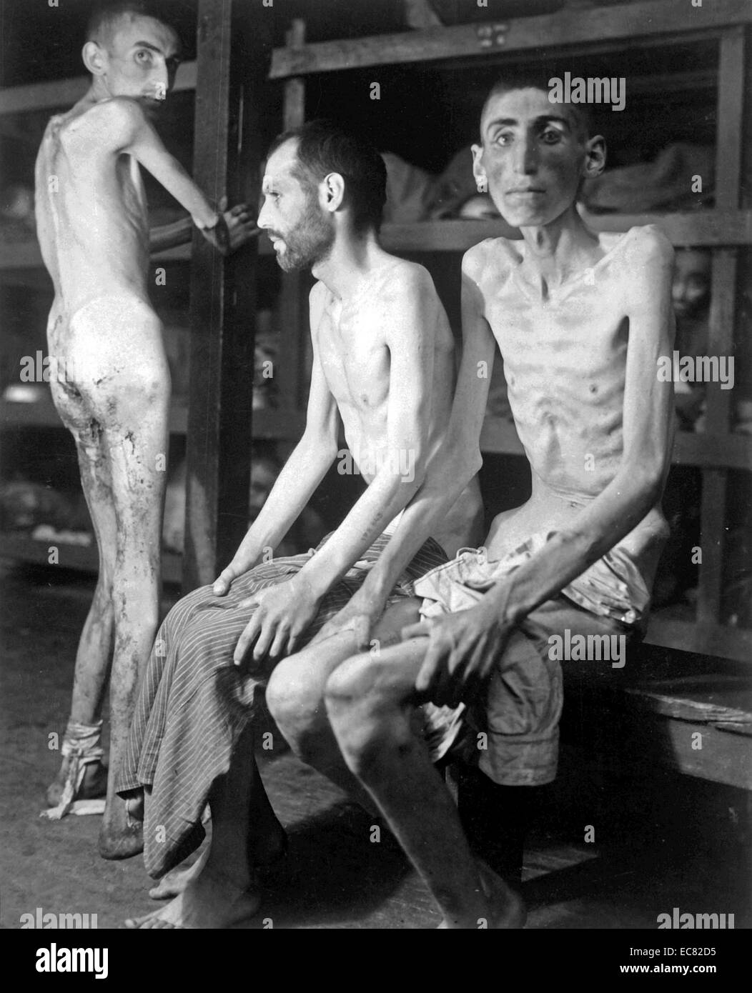 Image shows three prisoners of war at the Buchenwalk concentration camp. They're said to be Russian, Polish, and Dutch. Dated around 1944 during the Second World War. Stock Photo