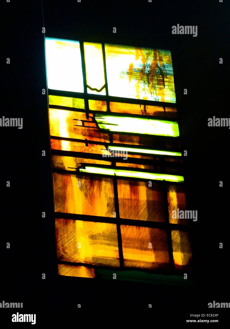 stained glass windows designed by john Piper depict the light of god