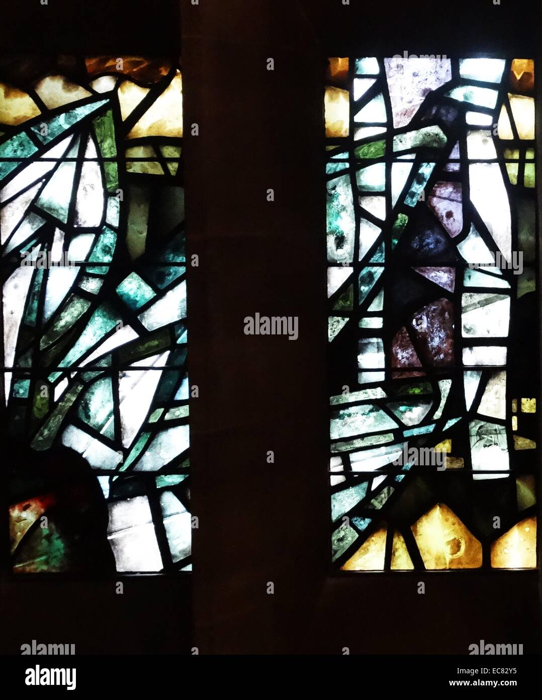 stained glass windows designed by john Piper depict the light of god