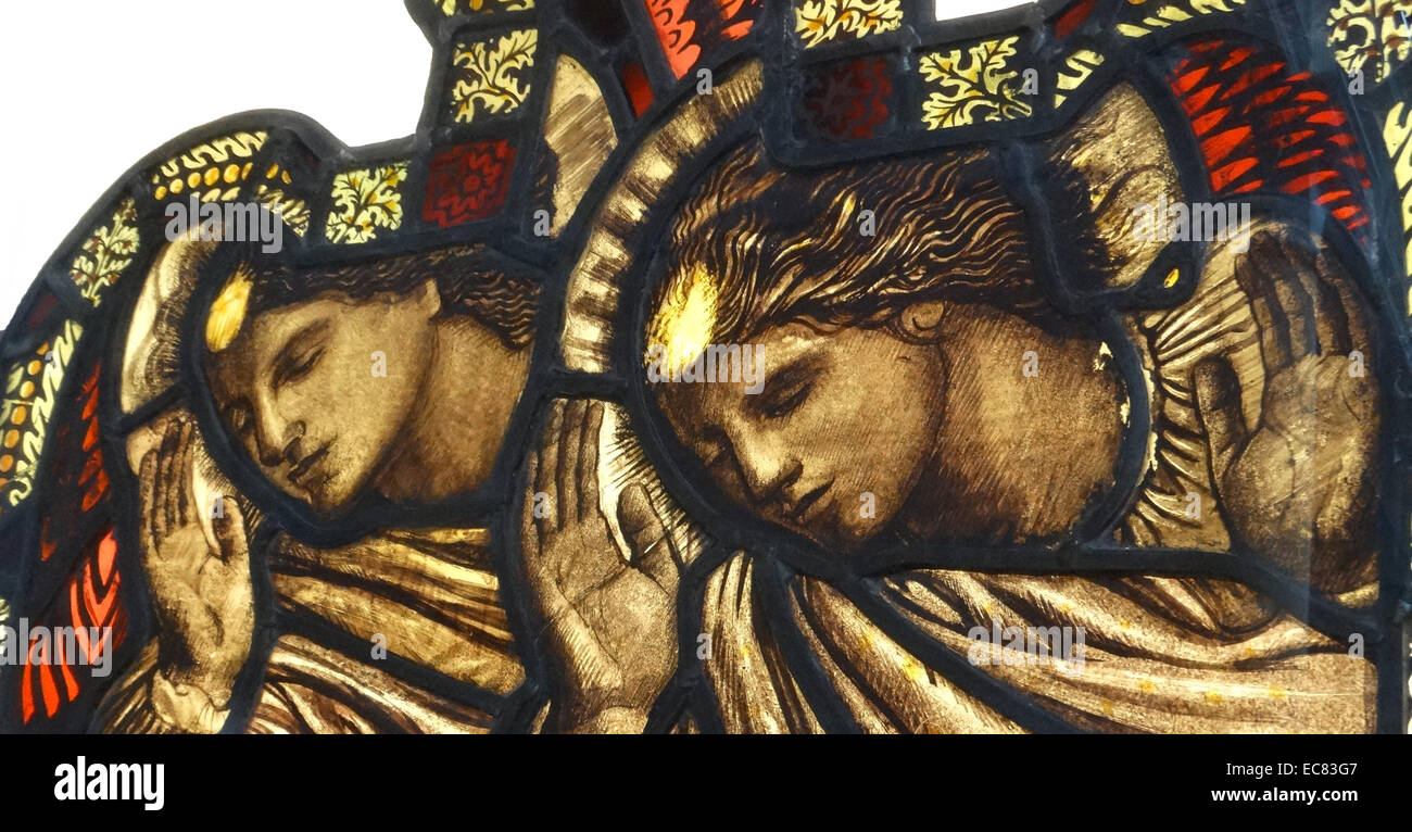 Peace and Goodwill by Henry Payne (1868-1940).This three-panel stained glass window was commissioned as a memorial 'to the men of the church who fell' and those who served in the Great War 1914-1918. Stock Photo