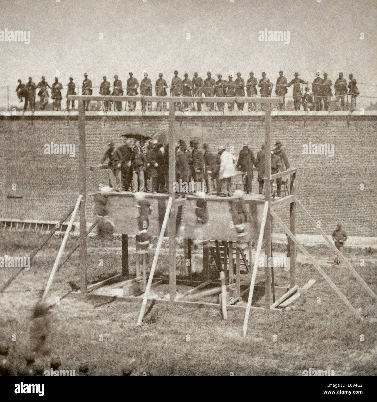 Photograph captures the moment just after the drop of the Lincoln Conspirators. Alexander Gardner (1821-1882) and his assistant captured the execution of the conspirtators of the assasination of the American President Abraham Lincoln (1809-1865) Gardner’s camera captures the moment just after the drop. Dated 1865 Stock Photo