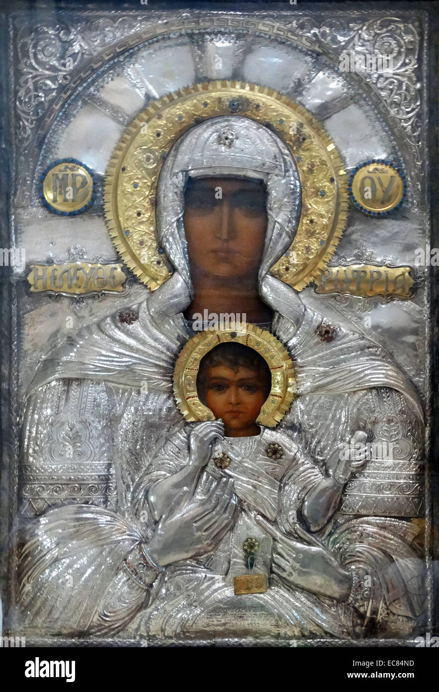 Greek Icon of the Virgin Mary with Christ in the Church of the Holy Sepulchre in Jerusalem. This church is identified as the place both of the crucifixion and the tomb of Jesus of Nazareth; originally built by the mother of Emperor Constantine in 330 A.D. The original Byzantine church was destroyed by the Persians in A.D. 614. Stock Photo